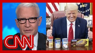 Cooper: Trump poses with can of beans while Covid-19 surges