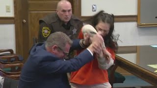 Woman attacks her own attorney while in court