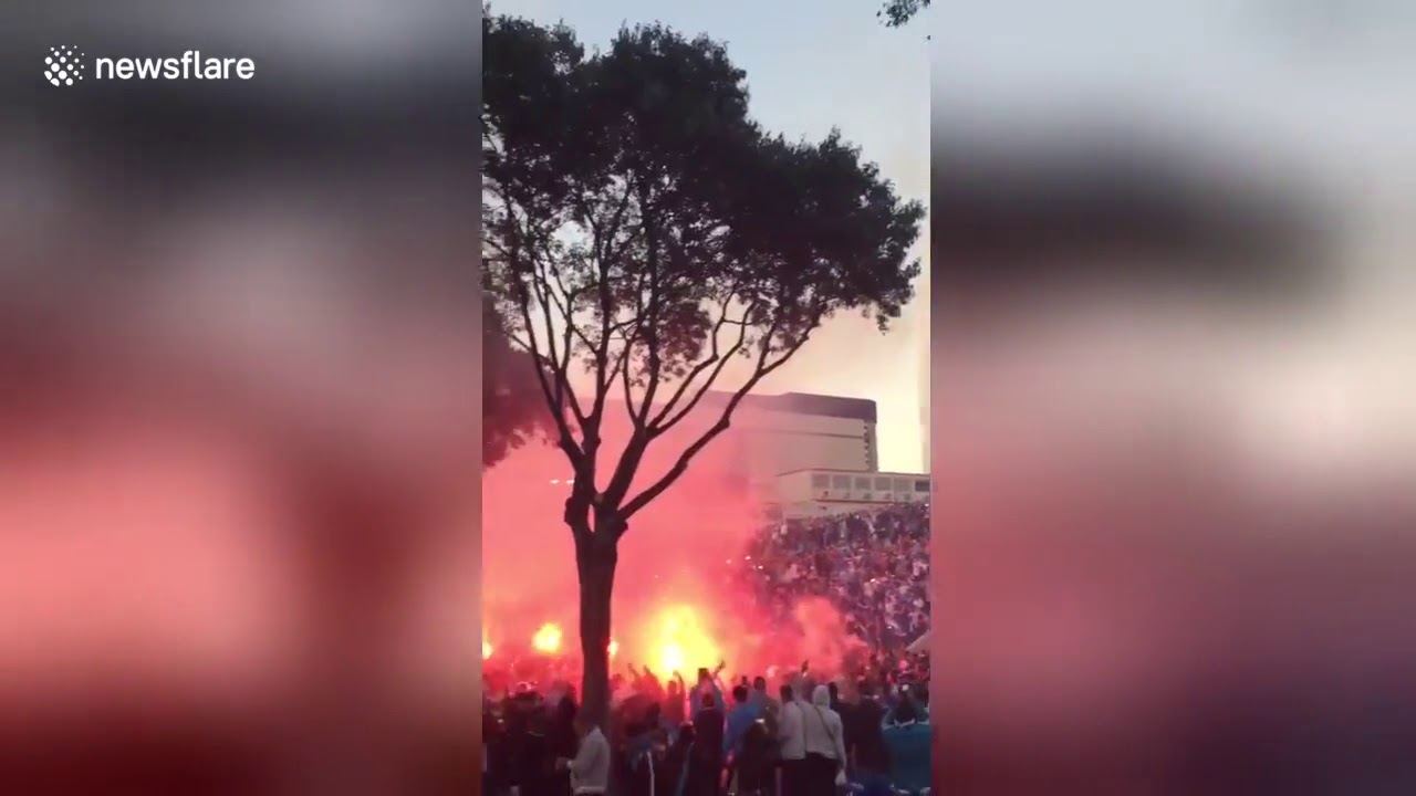OM fans light up flares in front of Stade Velodrome in Marseille