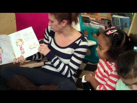 Demonstration of "finger-pointing" to teach concept of words in text