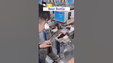 Print on the beer bottles with half-automatic pad printing machine.