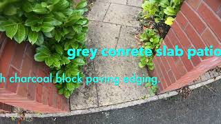 concrete grey slab patio with charcoal block paving edge   4K
