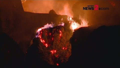 Hundreds of hay bales burn in barn fire