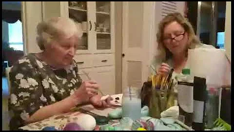 Mother (Ruth Baird Shaw) painting rocks with Carol...