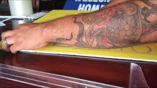Applying adhesive vinyl to foam boards