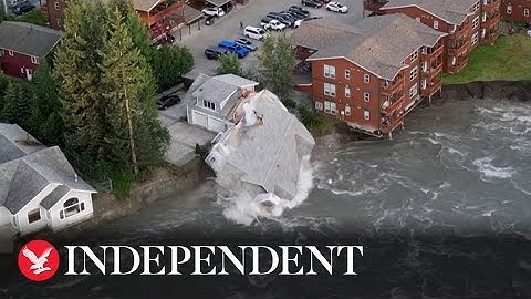 Alaska house crashes into river as glacier flood batters riverbank