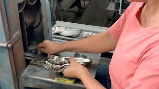 The shocking process of mass production of beautiful fork cutlery. Tableware factory