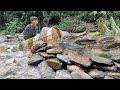 Nams orphan boy weaves bamboo cages blocked the streamsarranges rocks to make traps to catch fish