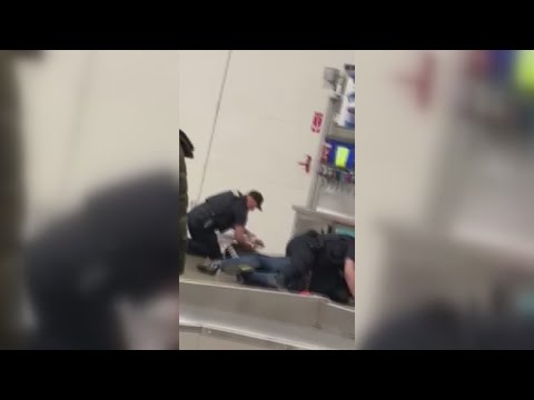 Raw video: Woman, her adult son arrested while trying to return TV