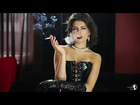 Attractive lady smokes cigarette