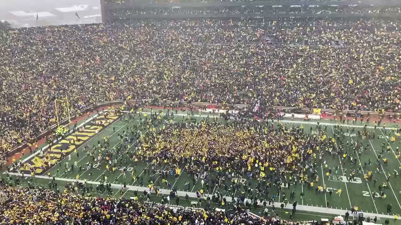 Michigan fans storm field after win over Ohio State YouTube