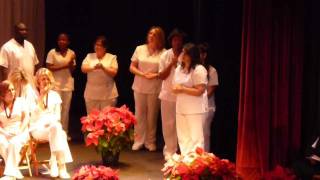 Liliana Morales accepting her Pin at the CCM Nursing Pinning Ceremony