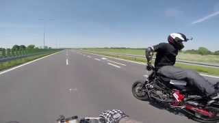 Crazy Guy Does Backwards Wheelie on Highway
