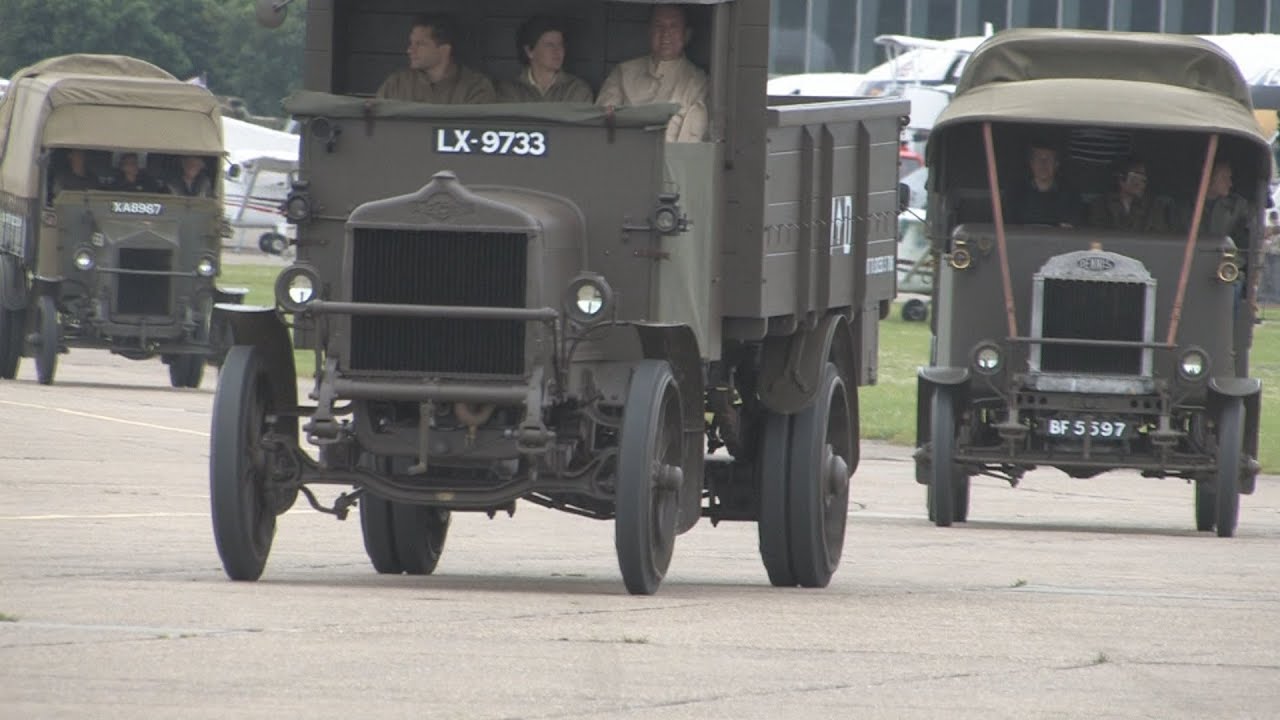 Vintage military road vehicles, at speed, on the Duxford ...