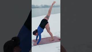 Evelina does stretching in the snow on the shore of the lake #stretching