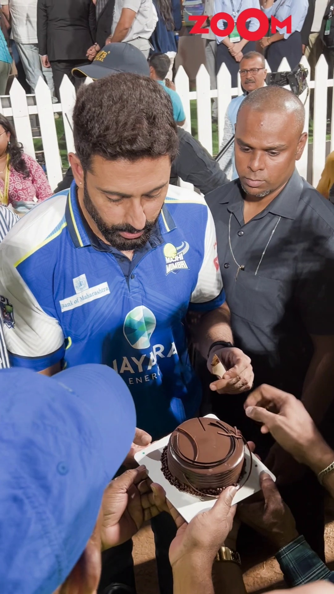 Abhishek Bachchan CUTS birthday cake with paps and fans' during a cricket match ? #abhishekhbachchan