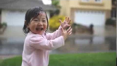 Baby girl experiences rain for the very first time