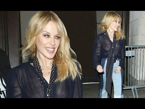 Kylie Minogue flashes her bra in sheer top after gig in London