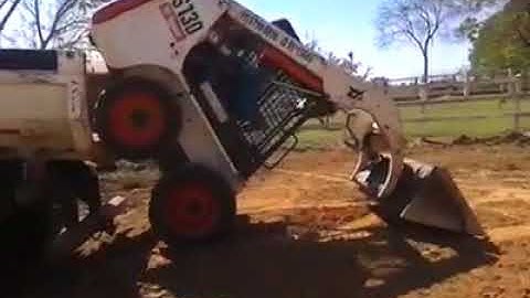 Bobcat Loading in Dumptruck