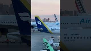 Iceland Air in the rare yellow tail stripe parking at Terminal 3 of Toronto Pearson