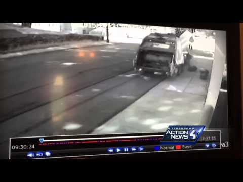 Raw: Runaway garbage truck slams into parked cars, workers chase after