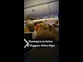 Passengers carried out of Singapore Airlines flight