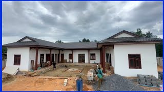Workers build beautiful, durable new houses in the countryside