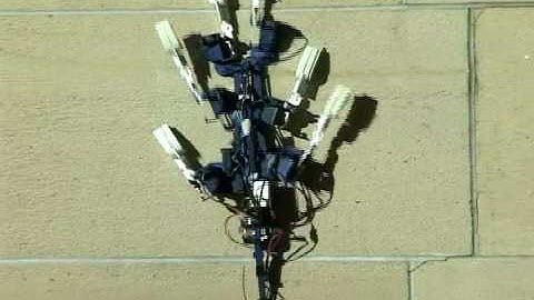 Spinybot II: Climbing walls with microspines
