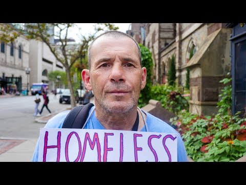 Homeless Man in Boston Flying a Sign That Reads "Homeless Sober Man Seeking Human Kindness."