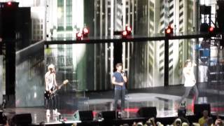 One Direction performing "Rock Me" at the First Midwest Ampitheatre in Tinley Park, Illinois.