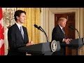 CNN-Trump defends travel ban, Trudeau has opposing view