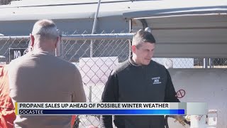 Customers stock up on propane tanks at Socastee Ace Hardware before winter storm