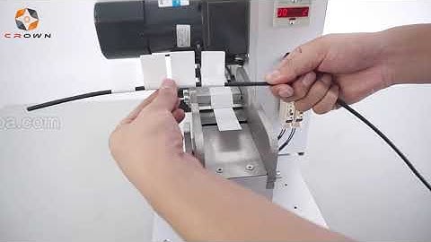 Labelling machine for wire harness/cable/tube with flag folded label