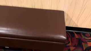 9809: Heavily-used cushioned bench at Cinemark Century 25 at Stadium Promenade in Orange