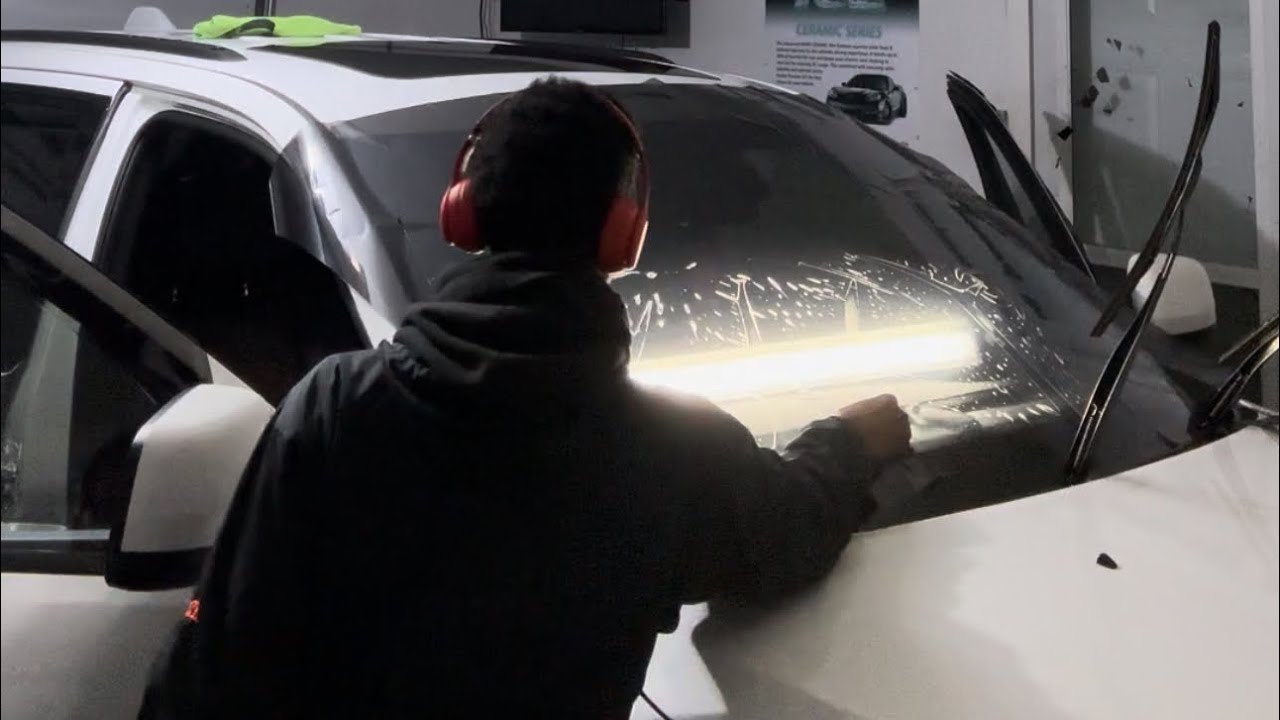 How to cut out a windshield for window tint - YouTube