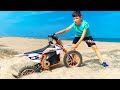 Funny Tema Ride on motocross bike Bike stuck in the sand on the beach He gets bike out of the sand