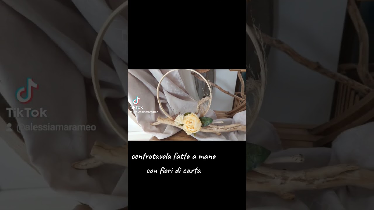 centrotavola cerimonia fatto a mano con fiori di carta crespa