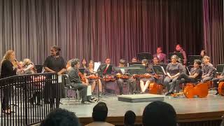 Ms. Casiano awarding her students at Honor orchestra at Brackenridge Highschool