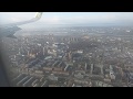 посадка самолета S7 в Иркутске. Вид города с высоты. Солнечный день.