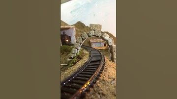 Train Track Through Stone Arch – Realistic Model Railroad