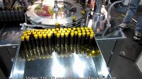 Filling machine capping penicillin vials with rubber plugs. Video 1162-2 www.Pharma-Manager.com