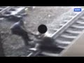 Cop Saves Man Seconds Before Train Arrives