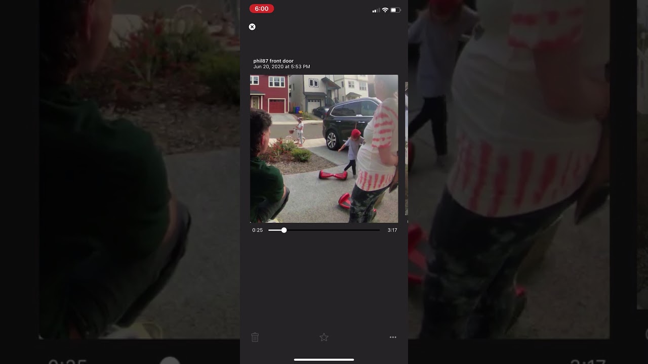 Boy in red hat attempts to ride hoverboard near car by driveway and falls on rear (Security camera)