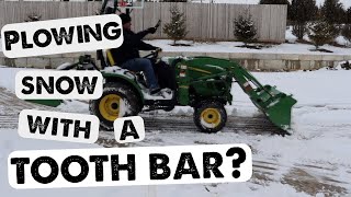 Plowing Snow With A Piranha Toothbar John Deere 2025R Plowing Snow