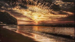 "Golden Sunset at Sea: A Captivating Yellow Beach Experience" screenshot 2