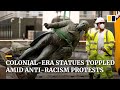 Colonial-era statues are toppled and damaged in global Black Lives Matter protests