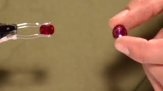 Comparing a Transparent Faceted Ruby to a Star Ruby by GIA