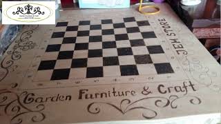 Table with chess design using wood burning