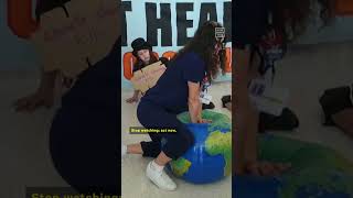 Activists at COP28 Perform CPR on Dying Earth