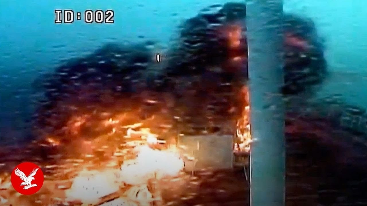 Moment two ships explode in huge fireball after deadly collision